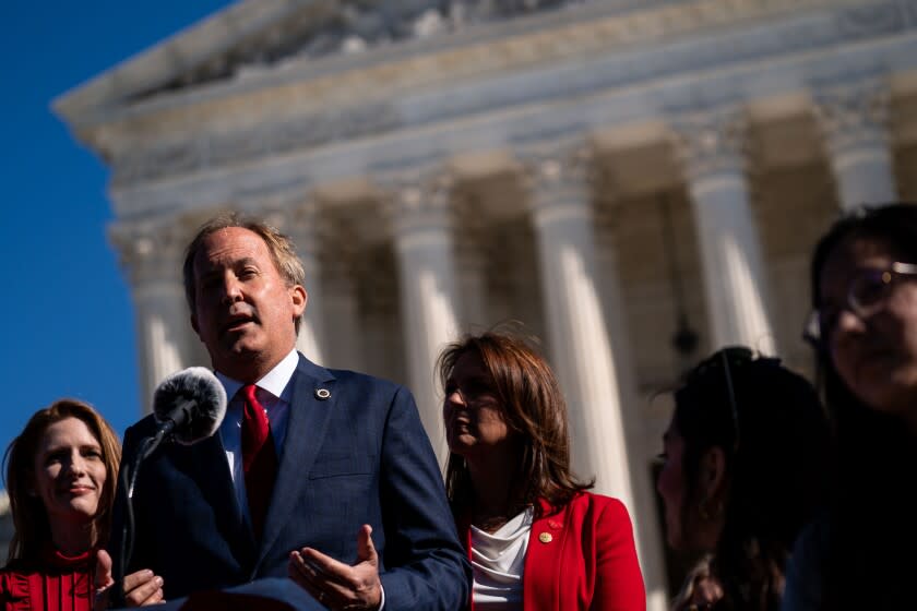 WASHINGTON, DC - NOVEMBER 01: Texas Attorney General Ken Paxton speaks outside the Supreme Court of the United States on Monday, Nov. 1, 2021 in Washington, DC. On Monday, Nov. 1, the Supreme Court heard arguments in a challenge to the controversial Texas abortion law that bans abortions after 6 weeks. (Kent Nishimura / Los Angeles Times)