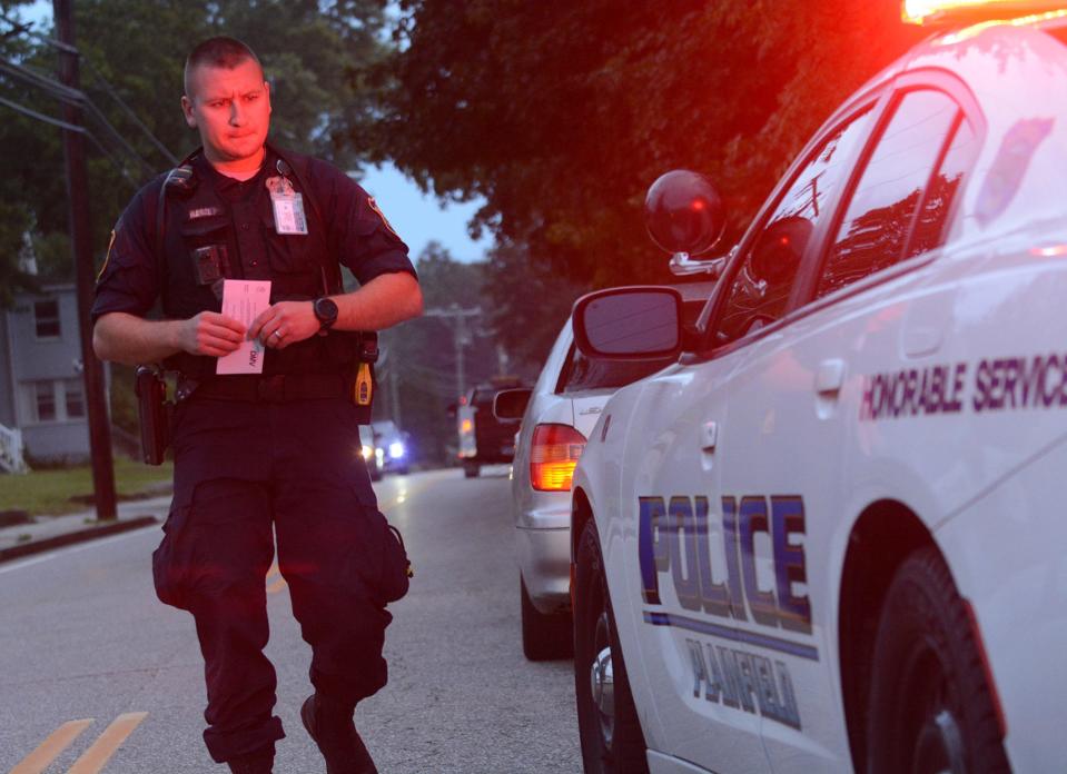 Plainfield Police officer Ryan Barile issues a verbal warning for no front plate to a motorist on Main Street in Moosup Sept. 20, 2021. Barile was the highest-paid town of Plainfield employee for fiscal 2023.