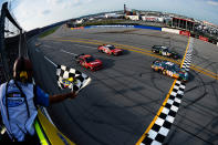 TALLADEGA, AL - MAY 05: Joey Logano, driver of the #18 GameStop Toyota, crosses the finish line to win the NASCAR Nationwide Series Aaron's 312 at Talladega Superspeedway on May 5, 2012 in Talladega, Alabama. (Photo by Jared C. Tilton/Getty Images)