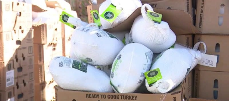 Padres players and volunteers handed out turkeys and sides to more than 1,000 San Diegans at Petco Park on Monday.