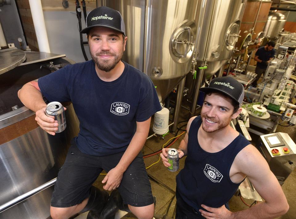 Jason Lavery, president and brewer, at left, and Logan Hartpence, brewer, at right, are shown at Lavery Brewing Co. in Erie on June 11, 2018.