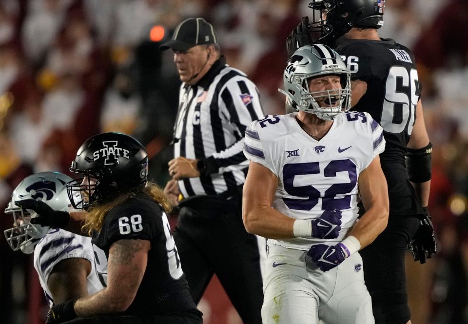 Kansas State linebacker Nick Allen (52) reacts after tripping Iowa State quarterback Hunter Dekkers earlier this season in a win over Iowa State