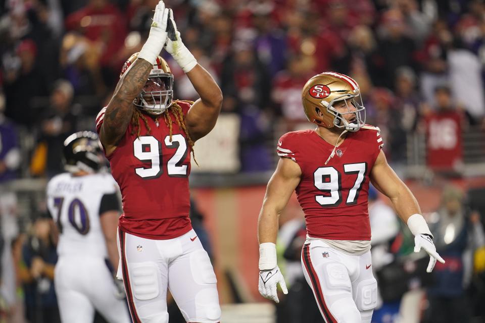 Dec 25, 2023; Santa Clara, California, USA; San Francisco 49ers defensive end Chase Young (92) reacts next to defensive end Nick Bosa (97) after play against the Baltimore Ravens in the first quarter at Levi's Stadium. Mandatory Credit: Cary Edmondson-USA TODAY Sports