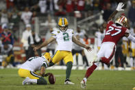 Green Bay Packers kicker Mason Crosby (2) kicks the game winning field goal from the hold of Corey Bojorquez during the second half of an NFL football game against the San Francisco 49ers in Santa Clara, Calif., Sunday, Sept. 26, 2021. (AP Photo/Jed Jacobsohn)