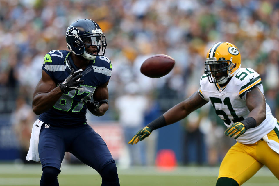 SEATTLE, WA - SEPTEMBER 24: Ben Obomanu #87 of the Seattle Seahawks makes a reception in the first half against D.J. Smith #51 of the Green Bay Packers at Qwest Field on September 24, 2012 in Seattle, Washington. (Photo by Otto Greule Jr/Getty Images)