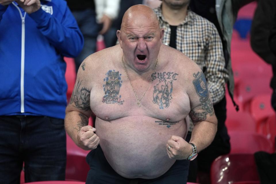 An England supporter poses for the camera during the Euro 2020 soccer championship group D match between England and Scotland at Wembley stadium in London, Friday, June 18, 2021. (AP Photo/Frank Augstein, Pool)