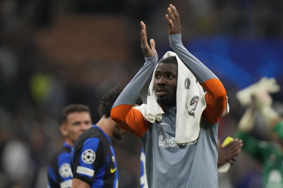 Inter Milan's Marcus Thuram applauds fans at the end of the Champions League, Group D soccer match between Inter Milan and Benfica, at the San Siro stadium in Milan, Italy, Tuesday, Oct. 3, 2023. Inter Milan won 1-0. (AP Photo/Luca Bruno)