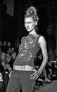 <p>Moss and McQueen's friendship transcended the runway. Here, the model is seen at the late British designer's debut New York fashion show in March 1996.</p> <p>The pair frequently worked together before McQueen's death in 2010; the designer famously featured <a href="https://www.creativereview.co.uk/alexander-mcqueens-kate-moss-hologram/" rel="nofollow noopener" target="_blank" data-ylk="slk:a hologram of Moss;elm:context_link;itc:0;sec:content-canvas" class="link ">a hologram of Moss</a> in his Fall/Winter 2006 show in Paris. </p>