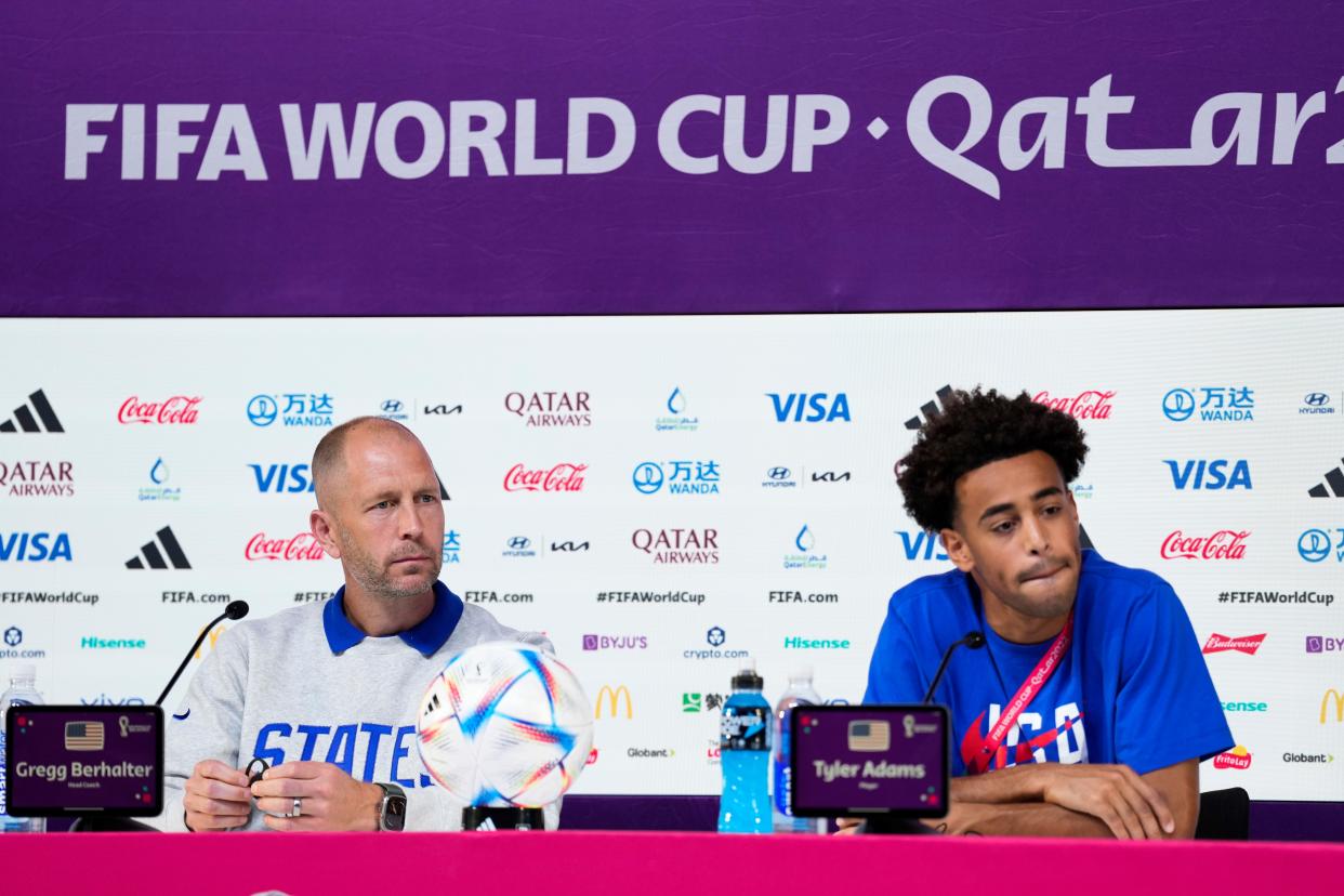 Head coach Gregg Berhalter of the United States and Tyler Adams attend a press conference on the eve of the group B World Cup soccer match between Iran and the United States in Doha, Qatar, Monday, Nov. 28, 2022.