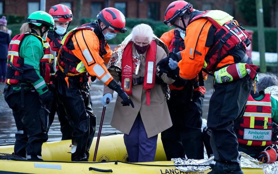 Elderly residents being evacuated -  Christopher Furlong/Getty Images
