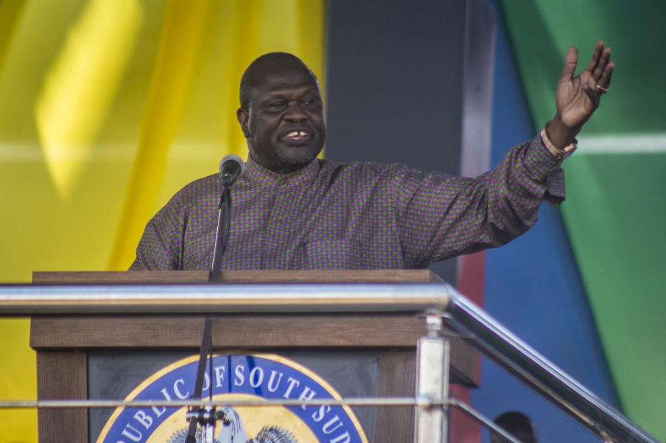 South Sudan's opposition leader Riek Machar speaks at peace celebrations in the capital Juba, South Sudan Wednesday, Oct. 31, 2018. For the first time since fleeing South Sudan more than two years ago, opposition leader Riek Machar returned on Wednesday to take part in a nationwide peace celebration. (AP Photo/Bullen Chol)