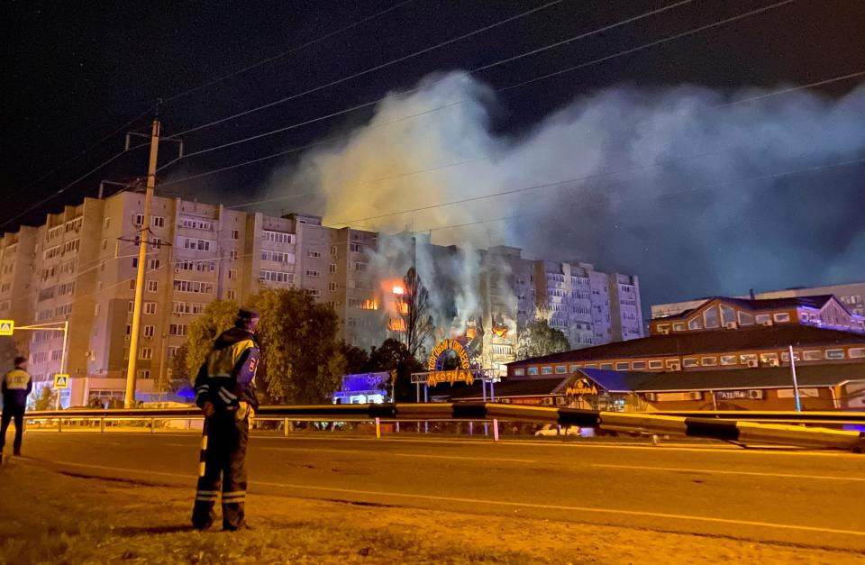 A view shows the site of a plane crash, after a Sukhoi Su-34 supersonic medium-range fighter-bomber plunged towards the residential building, in the southern city of Yeysk, Russia October 17, 2022.