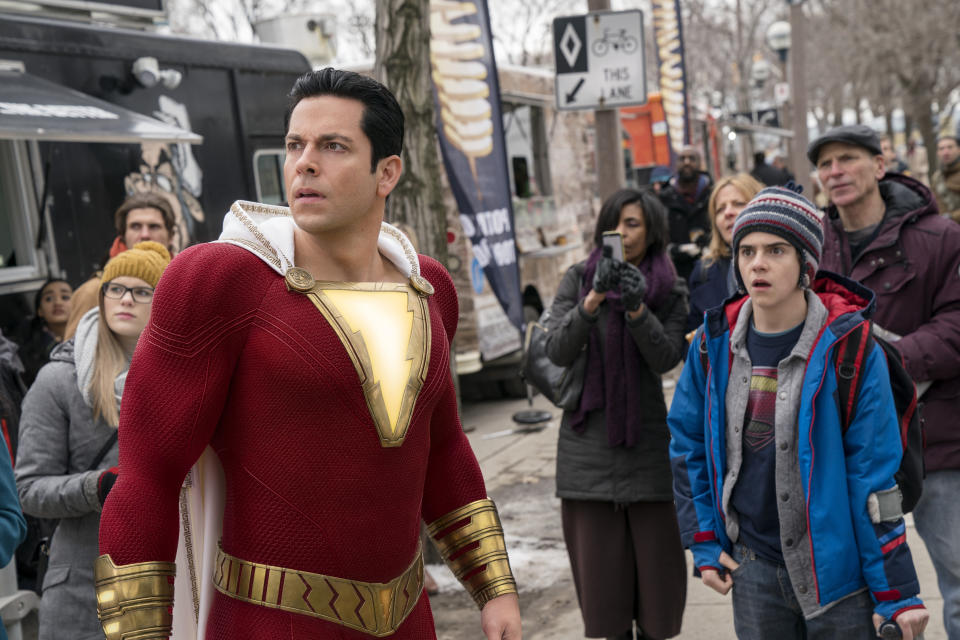 This image released by Warner Bros. shows Zachary Levi, left, and Jack Dylan Grazer in a scene from "Shazam!" (Steve Wilkie/Warner Bros. Entertainment via AP)