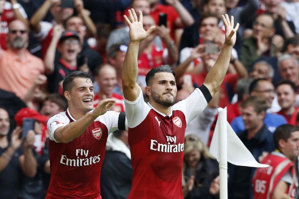 Arsenal's defender Sead Kolasinac (R) celebrates scoring on August 6, 2017