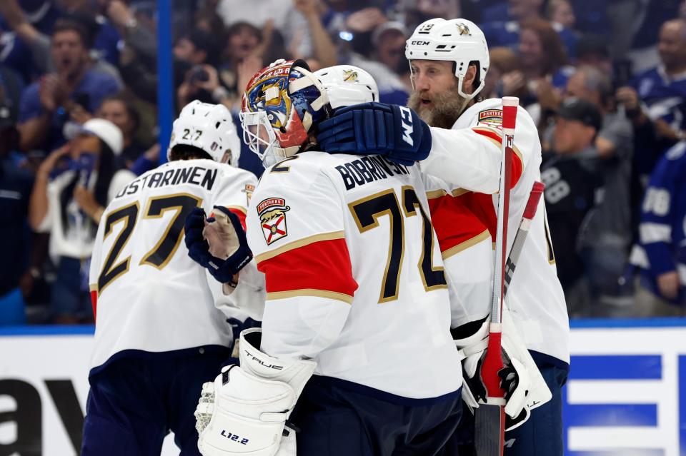 Panthers center Joe Thornton (19) consoles goaltender Sergei Bobrovsky (72) after Florida was eliminated from the Stanley Cup playoffs Monday night by the Lightning in Tampa.