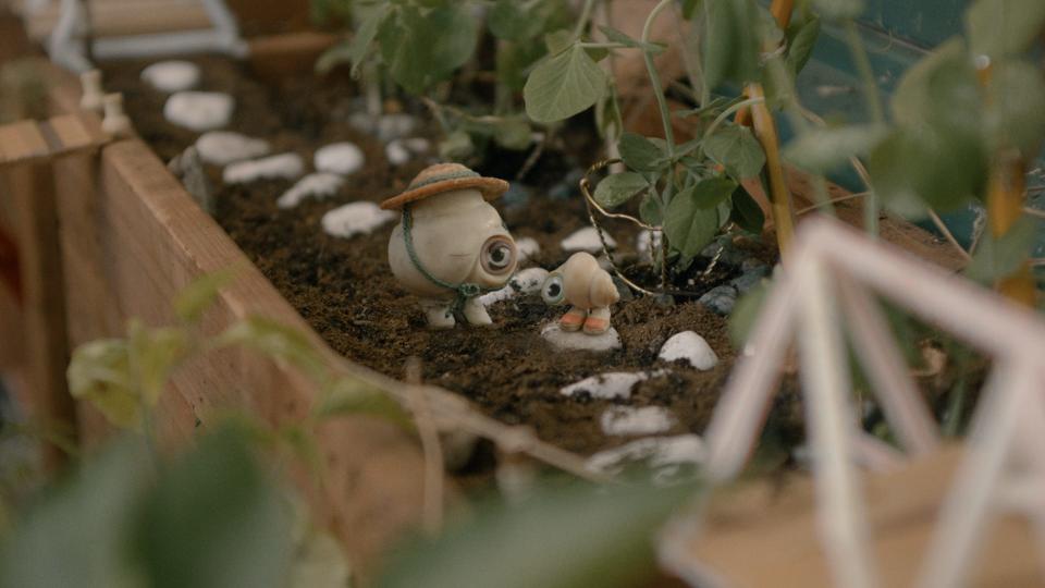 Marcel, a one-inch-tall shell pictured here with his grandmother, Connie, is the star of the 2022 film "Marcel the Shell with Shoes On."