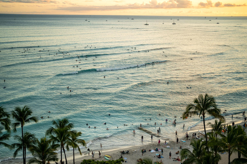 HONOLULU, HI - JUNE 26: The sun sets off of Waikiki Beach on the Hawaiian island of Oahu on Saturday, June 26, 2021 in Honolulu, HI. (Kent Nishimura / Los Angeles Times via Getty Images)