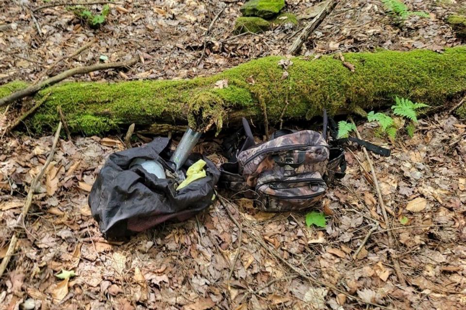 In this image provided by the Pennsylvania State Police, two bags of supplies, authorities believe belong to an escaped inmate, were found by law enforcement while searching in the woods in northwestern Pennsylvania. (Pennsylvania State Police via AP) (AP)