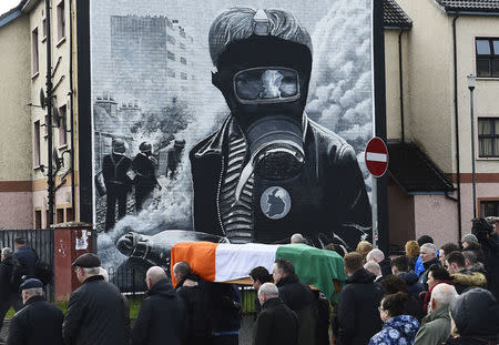 Pall bearers carry the coffin of Martin McGuinness through the streets of Londonderry, Northern Ireland. REUTERS/Clodagh Kilcoyne