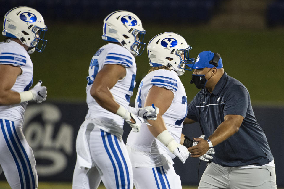 BYU head coach Kalani Sitake reacts with his team during the first half of an NCAA college football game against the Navy, Monday, Sept. 7, 2020, in Annapolis, Md. (AP Photo/Tommy Gilligan)