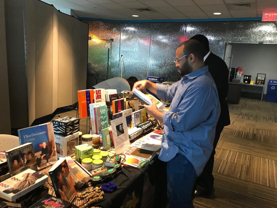 Shoppers browse titles at Mejah Books, who was a vendor at Barclays Black-Owned Small Business Expo.