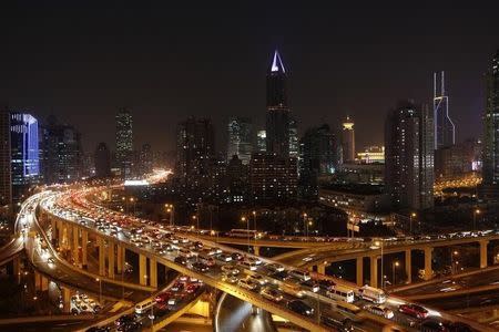 Vehicles drive on flyovers during the evening rush hour in central Shanghai December 29, 2010. REUTERS/Aly Song