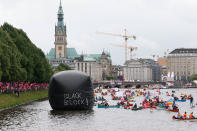 <p>Protesters demonstrating against the upcoming G20 economic summit ride boats on Inner Alster lake during a protest march on July 2, 2017 in Hamburg, Germany. Hamburg will host the upcoming G20 summit and is expecting heavy protests throughout. (Morris MacMatzen/Getty Images) </p>