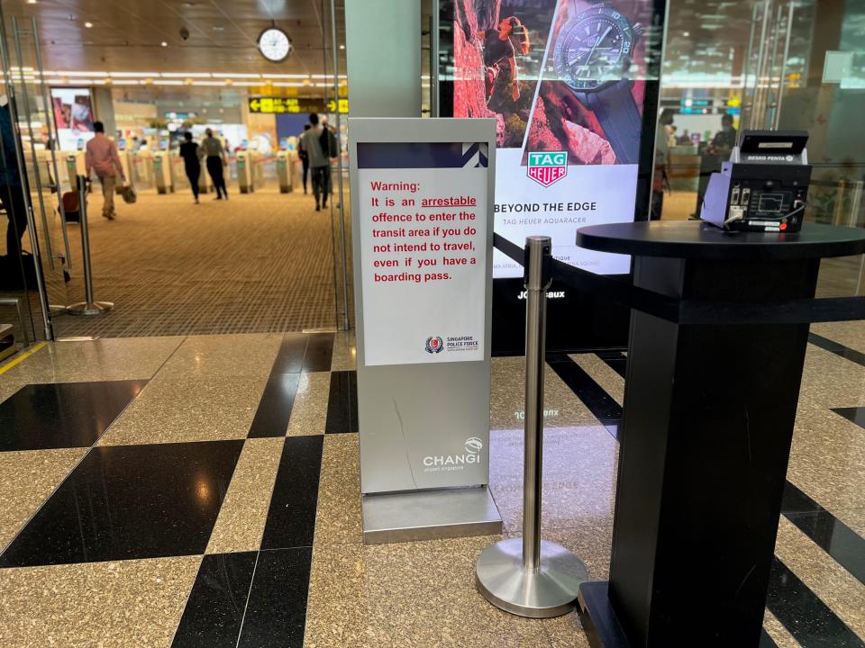 A sign at Changi that says only ticketed passengers are allowed in the transit area.