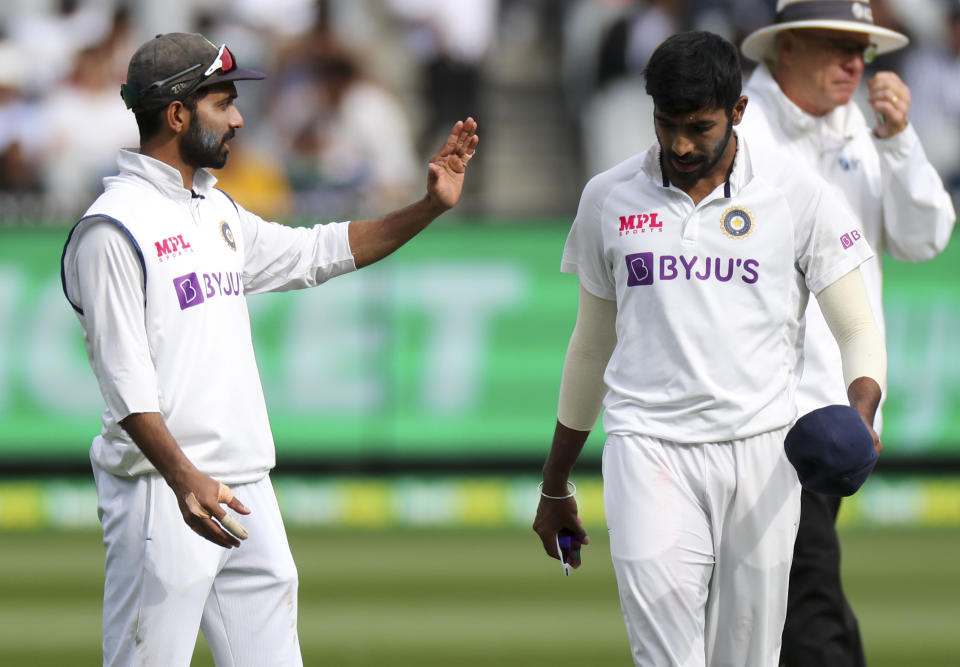 India's Ajinkya Rahane, left, talks with his bowler Jasprit Bumrah during play on day three of the second cricket test between India and Australia at the Melbourne Cricket Ground, Melbourne, Australia, Monday, Dec. 28, 2020. (AP Photo/Asanka Brendon Ratnayake)