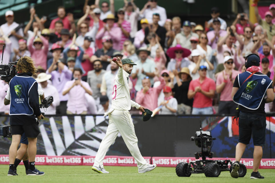 Australia's Nathan Lyon leaves the field after taking 5 wickets on day three of the third cricket test match between Australia and New Zealand at the Sydney Cricket Ground in Sydney Sunday, Jan. 5, 2020. (Andrew Cornaga/Photosport via AP)