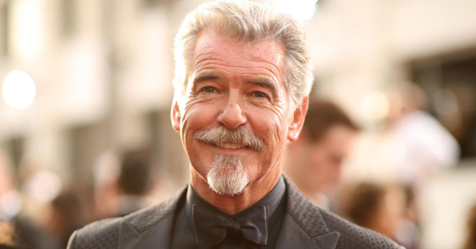 Pierce Brosnan on the red carpet, smilling