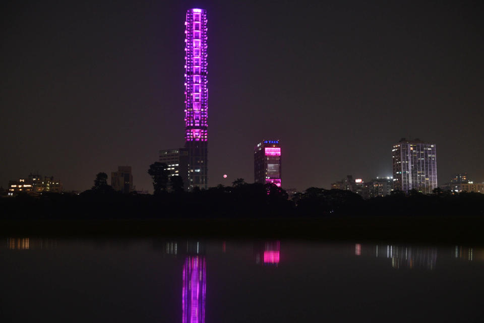 KOLKATA, INDIA NOVEMBER 21: The 42 and Tata Center buildings are illuminated on the eve of India's first pink Ball test match against Bangladesh, as seen from Kolkata Maidan area, on November 21, 2019 in Kolkata, India. (Photo by Samir Jana/Hindustan Times via Getty Images)