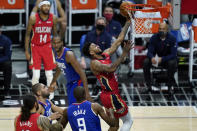 New Orleans Pelicans guard Nickeil Alexander-Walker (6) shoots past Los Angeles Clippers center Serge Ibaka (9) during the second quarter of an NBA basketball game Wednesday, Jan. 13, 2021, in Los Angeles. (AP Photo/Ashley Landis)