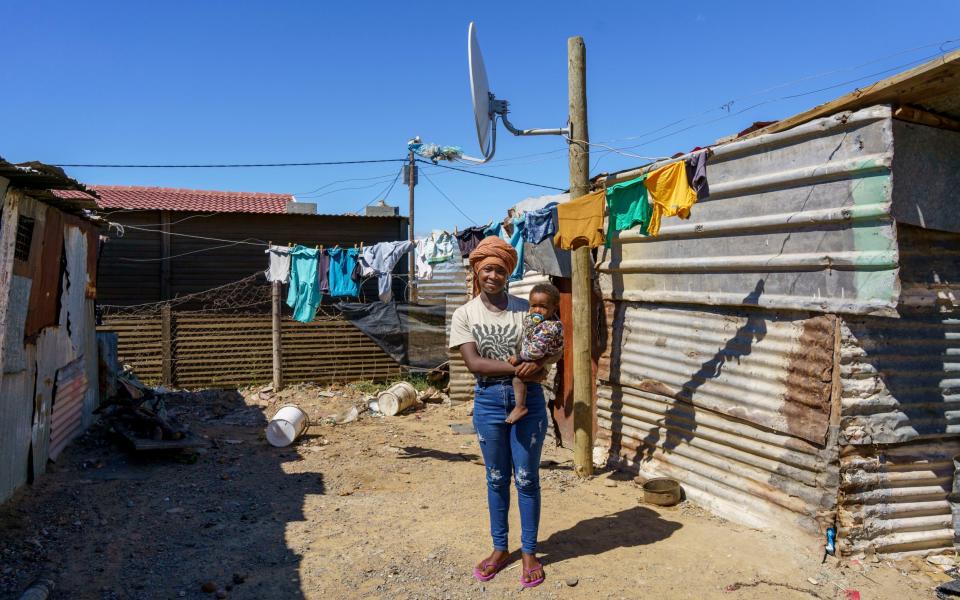 Rochelle Ntsimbi with her 11 month old baby Thando at their home in Avian Park