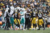 Jan 8, 2017; Pittsburgh, PA, USA; The Pittsburgh Steelers and the Miami Dolphins exchange words during the first half in the AFC Wild Card playoff football game at Heinz Field. Mandatory Credit: James Lang-USA TODAY Sports