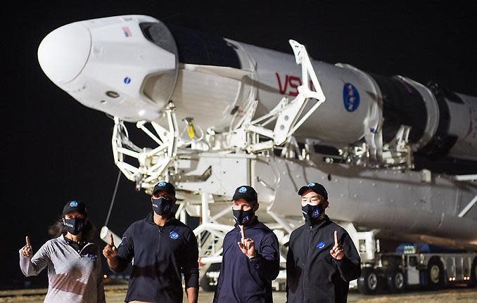 The Crew-1 astronauts visit pad 39A for rollout of their Falcon 9 and Crew Dragon capsule overnight Monday. Left to right: Shannon Walker, Victor Glover, Michael Hopkins and Japanese astronaut Soichi Noguchi. / Credit: NASA