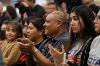 People clap for Democratic U.S. presidential candidate Senator Elizabeth Warren at the Mi Familia Vota community event at the Cardenas Market in Las Vegas