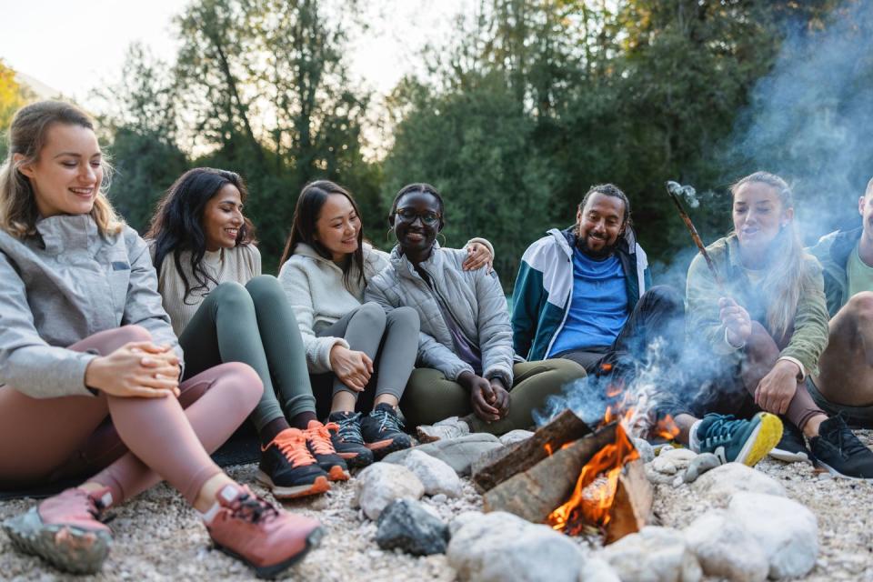 a group of people sitting on rocks