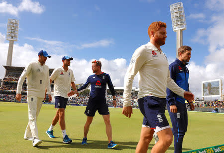 Cricket - Ashes test match - Australia v England - WACA Ground, Perth, Australia, December 18, 2017. England's Jonny Bairstow walks off the ground with team mates after losing the third Ashes cricket test match. REUTERS/David Gray