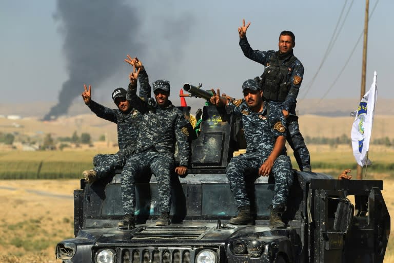 Iraqi government forces equipped with US weapons and vehicles have taken control of the rich oil fields around the Kurdish-claimed city of Kirkuk