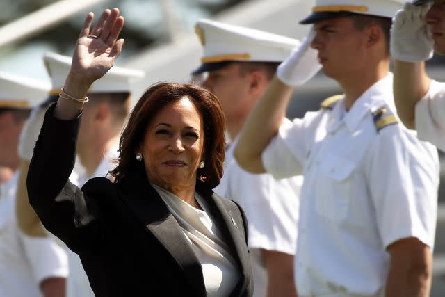 <p>Spencer Platt/Getty Images</p> Kamala Harris waves to graduates at West Point