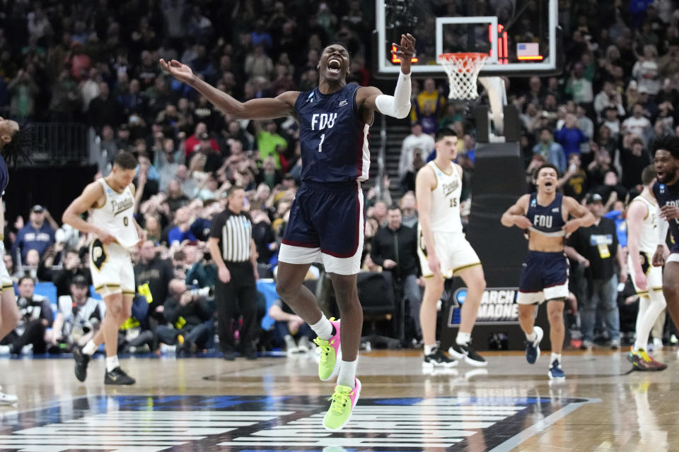 Fairleigh Dickinson guard Joe Munden Jr. (1) celebrates beating Purdue 63-58 after a first-round college basketball game in the NCAA Tournament Friday, March 17, 2023, in Columbus, Ohio. (AP Photo/Paul Sancya)