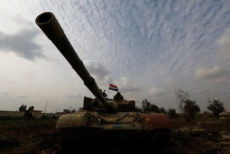 A tank of Iraqi army is seen during a fight with Islamic State militants in Rashidiya, North of Mosul, Iraq, January 30, 2017. REUTERS/Muhammad Hamed