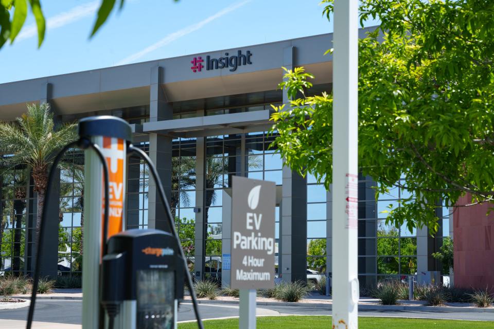 An electric vehicle parking station is seen in front of Insight Enterprise's Chandler offices on March 31, 2023.