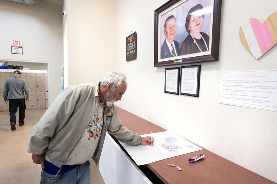 Shelter resident Jeff Ford spends his time drawing at the Salvation Army Berberian Center in Modesto, Calif., Wednesday, Nov. 22, 2023.