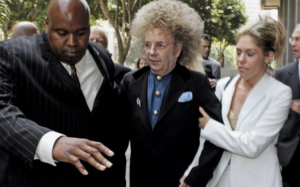 Phil Spector leaving court in 2005 - AP