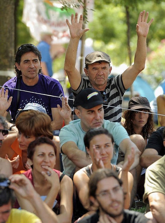 Spanish "indignant" activists gather at Constitucion Square before a march through the streets of Madrid which will end at Puerta del Sol Square. Seven cross-country protest marches organised by Spain's "indignant" movement are set to converge Saturday in central Madrid, on the eve of a demonstration in the Spanish capital