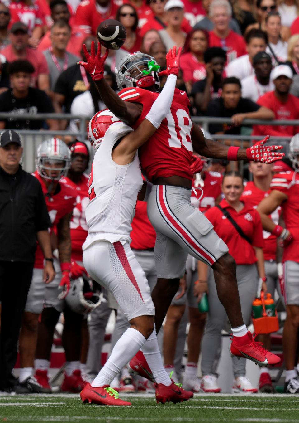 Sept. 9, 2023; Columbus, Oh., USA; 
DUPLICATE***Ohio State Buckeyes wide receiver Marvin Harrison Jr. (18)***Ohio State Buckeyes cornerback Jyaire Brown (18) gets tangled up with DUPLICATE***Youngstown State Penguins wide receiver C.J. Charleston (2)***Youngstown State Penguins defensive back Troy Jakubec (2) during the first half of Saturday's NCAA Division I football game at Ohio Stadium.