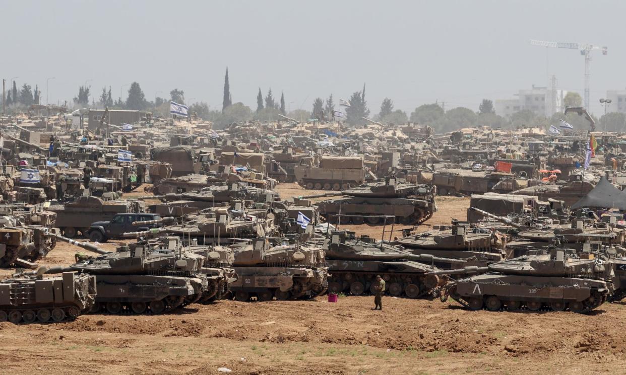 <span>Israeli troops gathering in southern Israel near the Gaza border on Thursday.<br></span><span>Photograph: Abir Sultan/EPA</span>