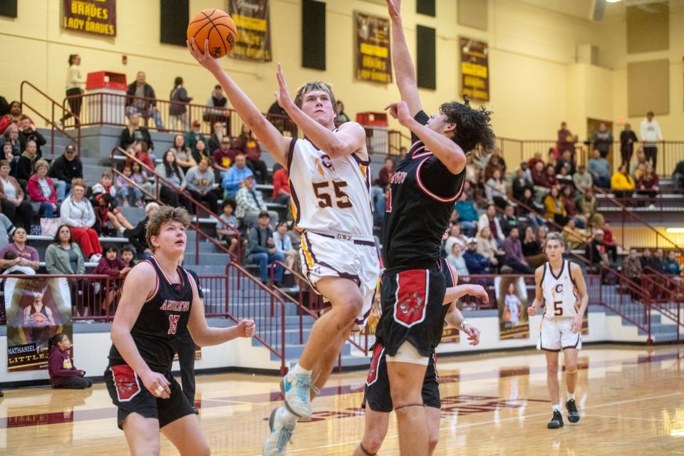 Cherokee’s Luke Smith shoots a layup as Andrews’ Cameron Rattler guards, January 30, 2024.